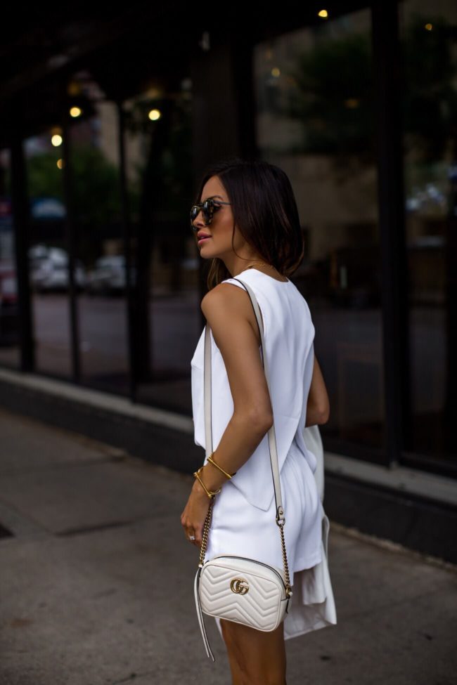 fashion blogger mia mia mine wearing a white romper from club monaco