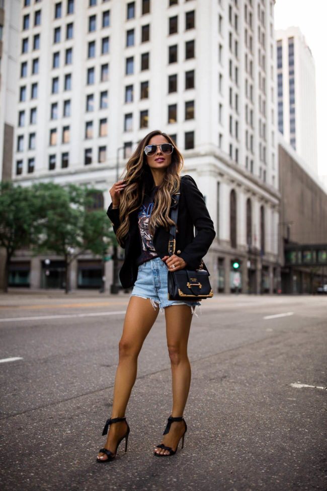 fashion blogger mia mia mine wearing a lioness blazer and a prada cahier bag