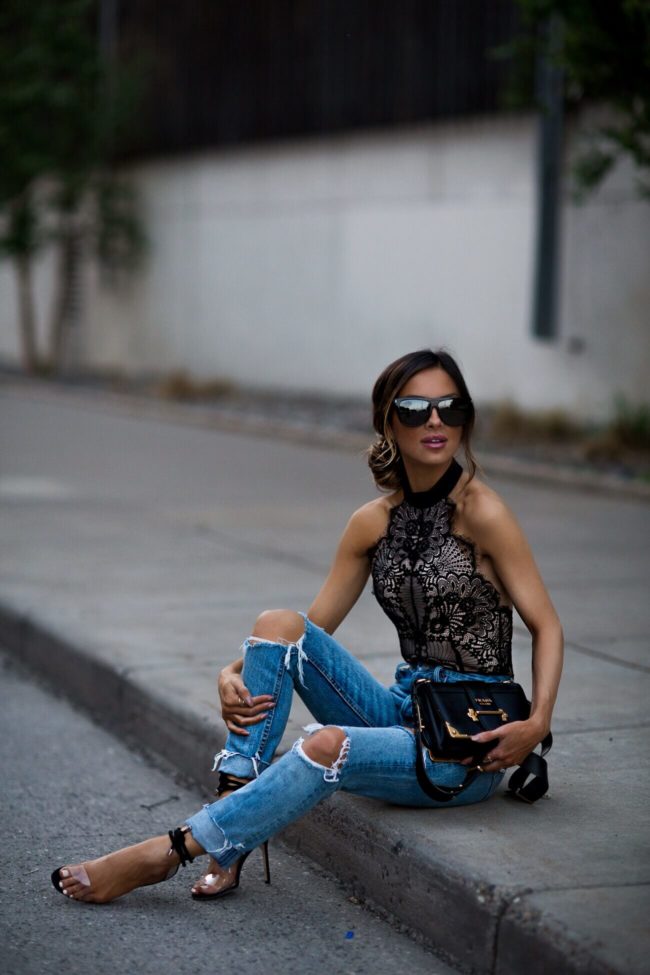 fashion blogger mia mia mine wearing a lace majorelle bodysuit from revolve and grlfrnd denim