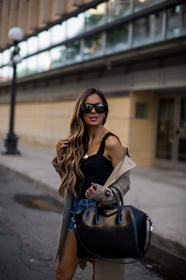 fashion blogger mia mia mine wearing saint laurent sunglasses and a burberry trench coat