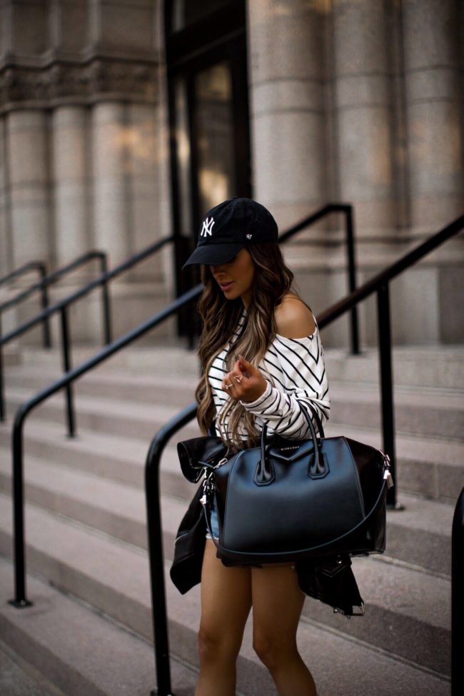 fashion blogger mia mia mine wearing a givenchy antigona bag and a striped top from H&M