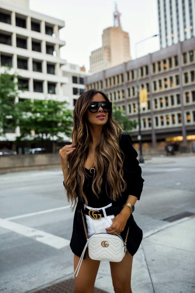 fashion blogger mia mia mine wearing a black bodysuit and a black topshop blazer from nordstrom