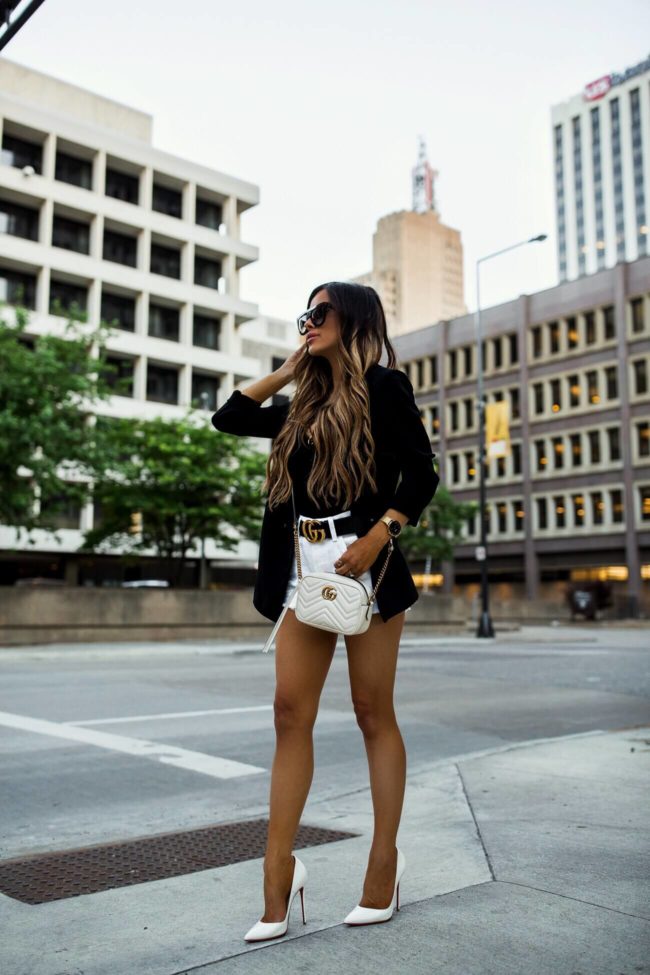 fashion blogger mia mia mine wearing a white crossbody gucci bag and a black topshop blazer from shopbop