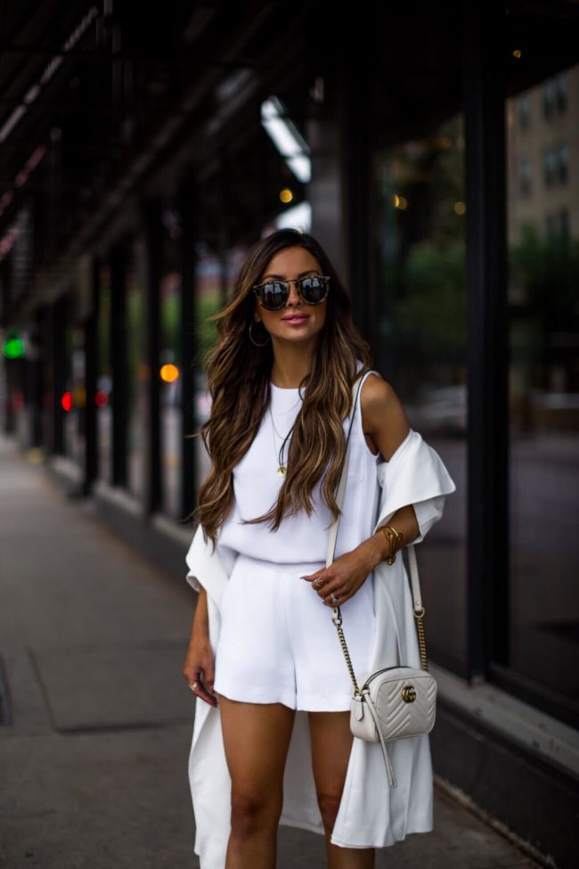 fashion blogger mia mia mine wearing a white romper from club monaco