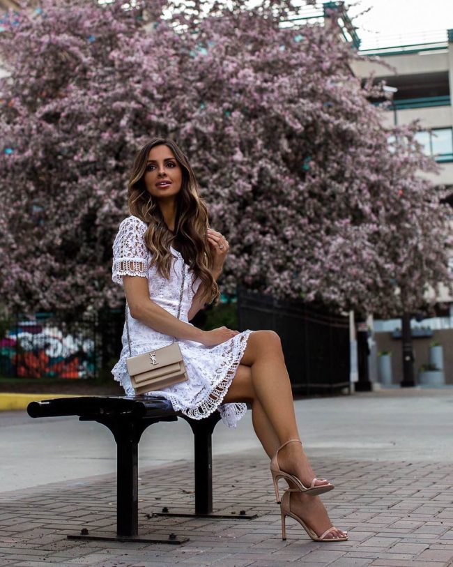 fashion blogger mia mia mine wearing a white lace french connection dress from bloomingdale's