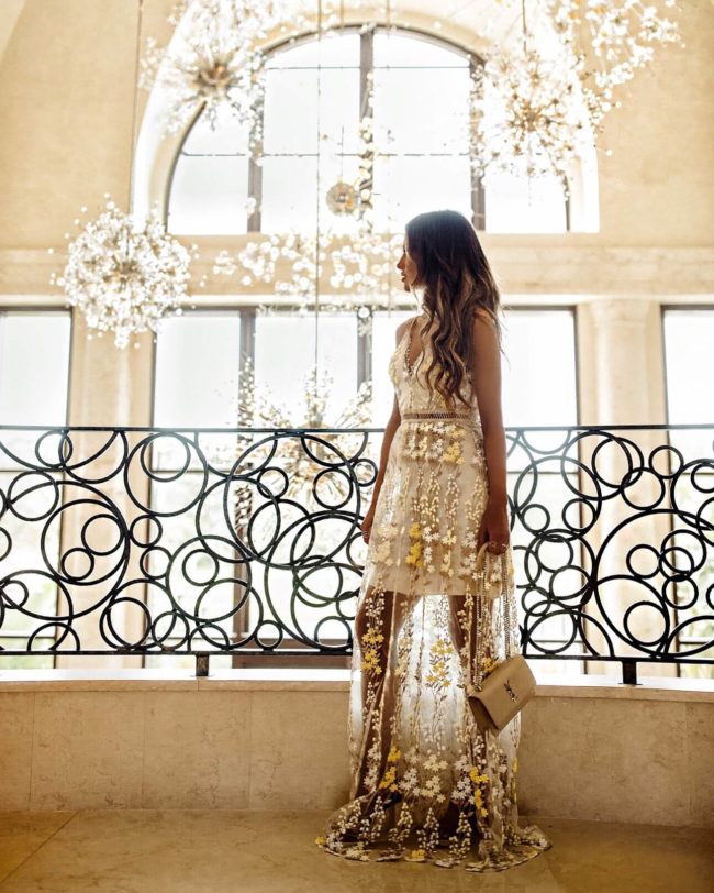 fashion blogger mia mia mine wearing a yellow lace embroidered dress from bloomingdale's