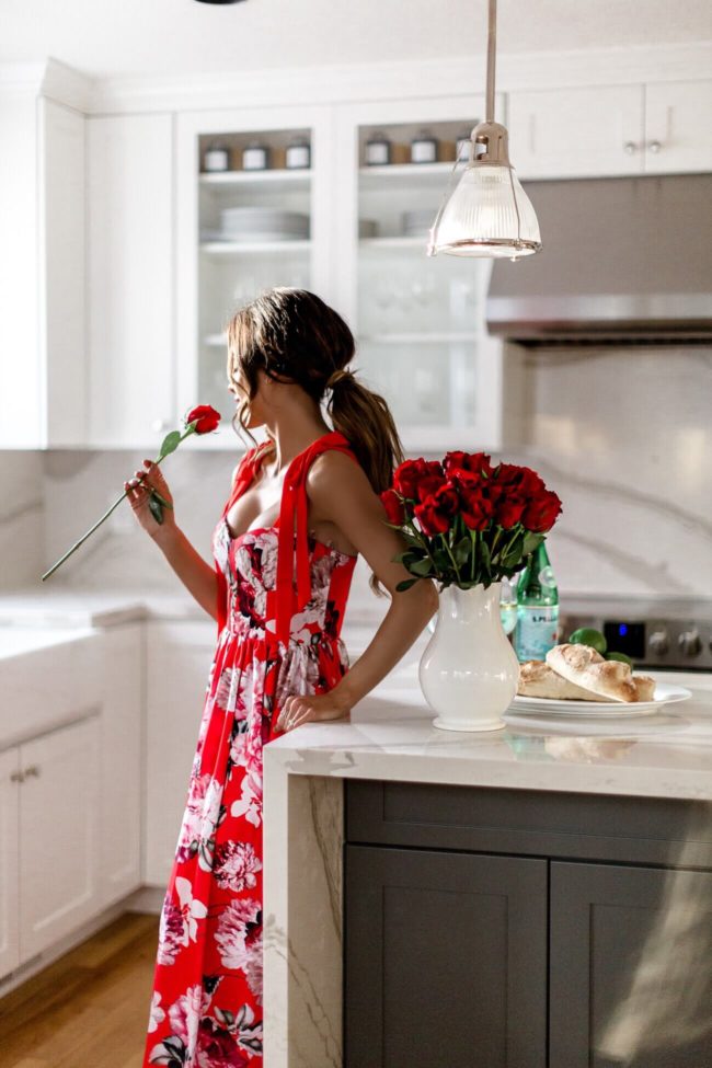 fashion blogger mia mia mine wearing a red floral maxi dress