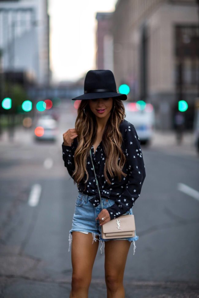 fashion blogger mia mia mine wearing a rag & bone black fedora hat and a saint laurent crossbody sunset bag