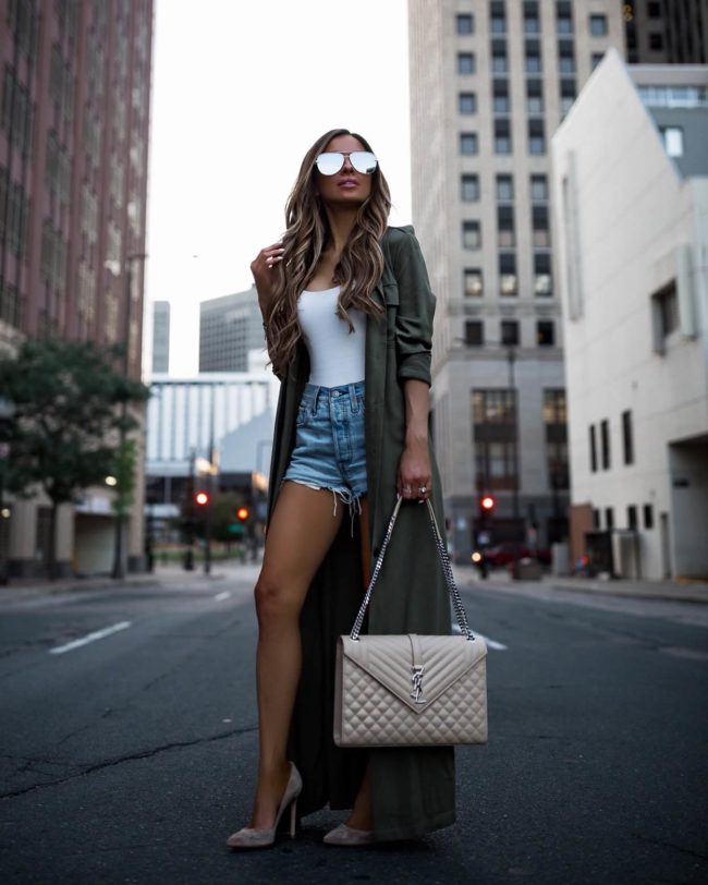 fashion blogger mia mia mine wearing an olive trench from revolve and a saint laurent bag from hgbags