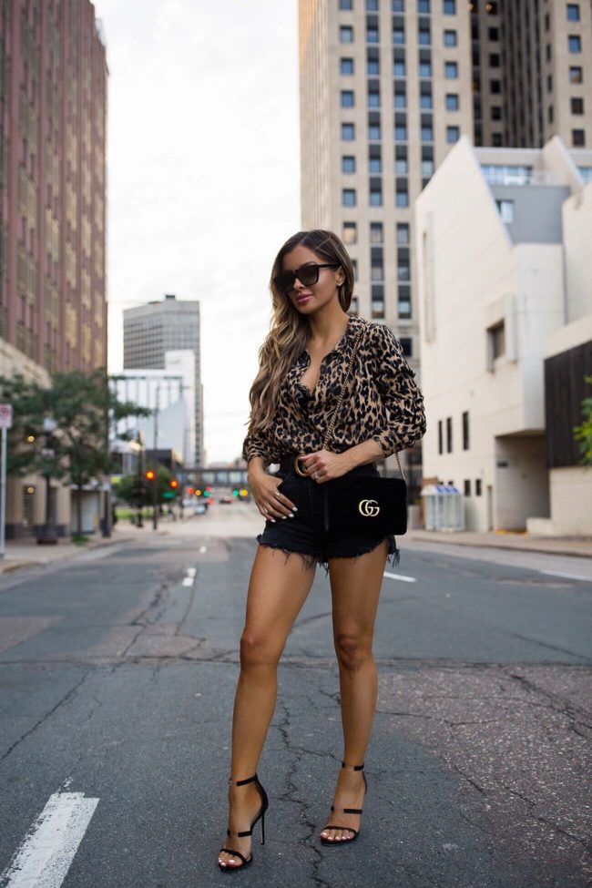 fashion blogger mia mia mine wearing nordstrom leopard shirt with black gucci belt and gucci velvet handbag