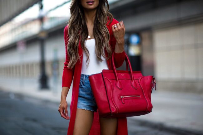fashion blogger carrying a red celine luggage tote