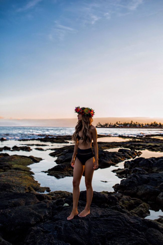 fashion blogger mia mia mine wearing a black revolve bikini at the four seasons resort hualalai hawaii