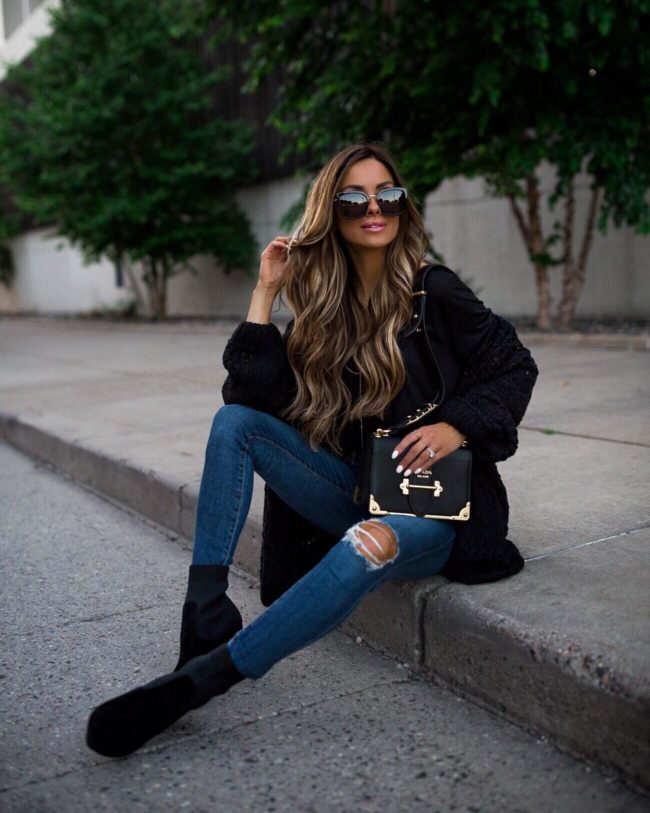 fashion blogger mia mia mine wearing a nordstrom anniversary sale black free people cardigan and steve madden sock booties