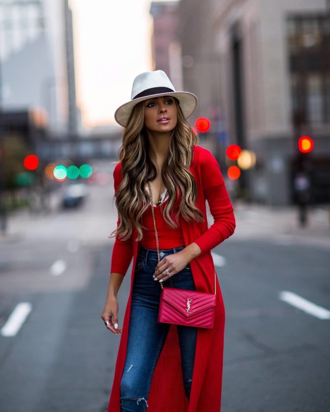 fashion blogger mia mia mine wearing a red bodysuit and a red duster from revolve