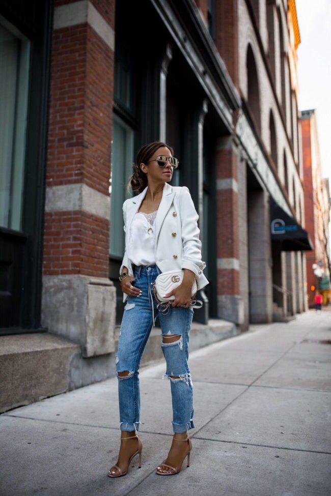 fashion blogger mia mia mine wearing a white lioness blazer and a gucci marmont mini bag