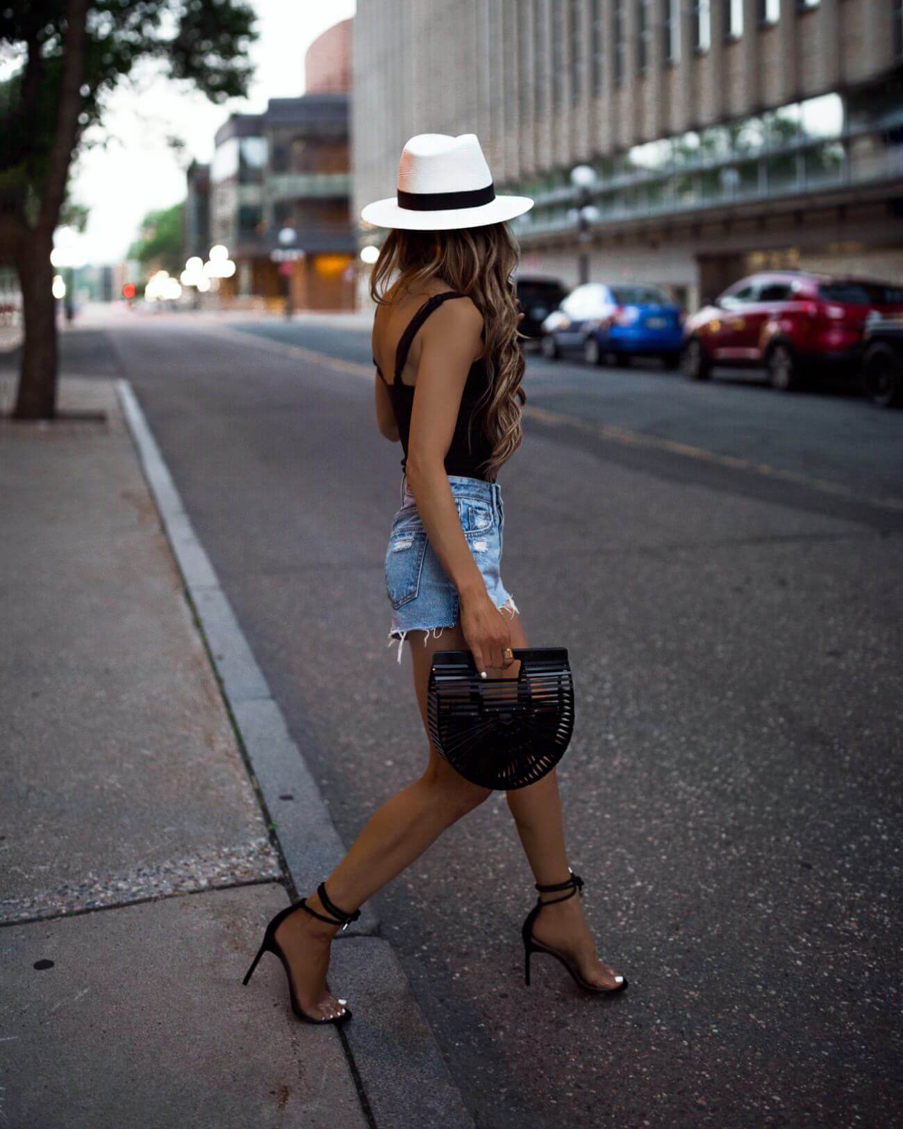 fashion blogger mia mia mine wearing a black bodysuit and white panama hat by rag & bone