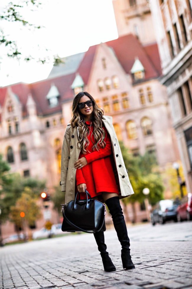 fashion blogger mia mia mine wearing a red sweater dress by free people and a burberry trench coat from nordstrom