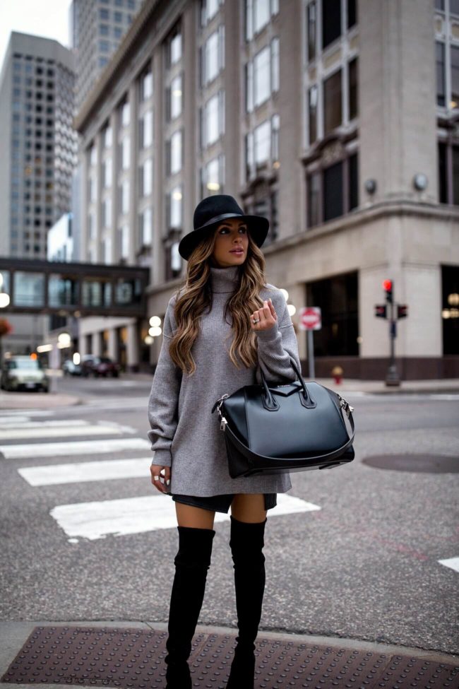fashion blogger mia mia mine wearing a gray turtleneck sweater dress by free people