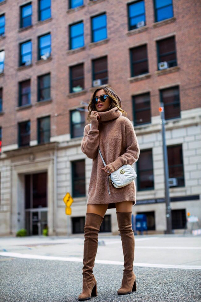 fashion blogger mia mia mine wearing a camel sweater dress from revolve and stuart weitzman over-the-knee boots from shopbop