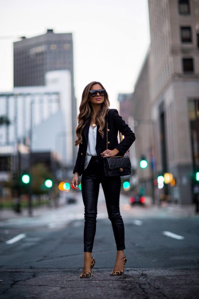fashion blogger mia mia mine wearing a black double-breasted blazer and leopard heels