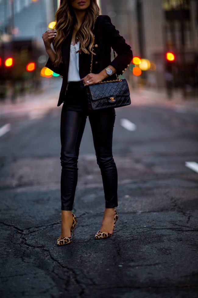 fashion blogger mia mia mine wearing faux leather pants and a chanel bag via ebay