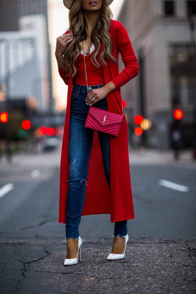 fashion blogger mia mia mine wearing a red saint laurent bag and christian louboutin white heels