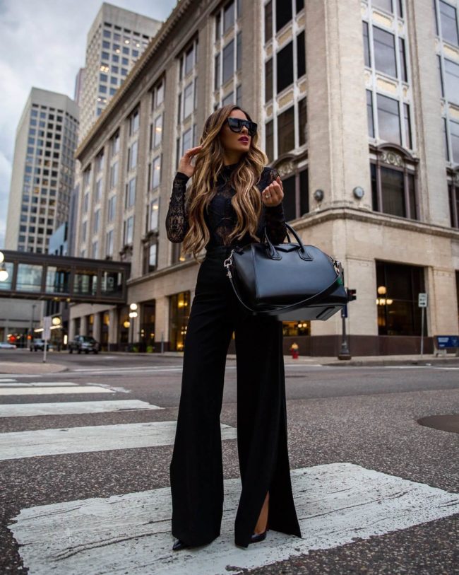 fashion blogger mia mia mine wearing a black lace bcbg bodysuit and bcbg work pants