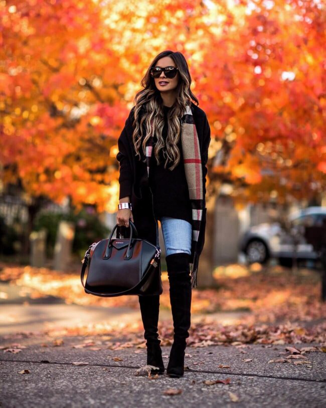 fashion blogger mia mia mine wearing a burberry stole and black over-the-knee boots for fall