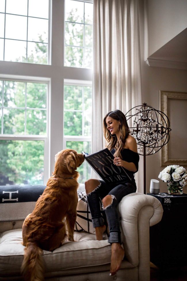 fashion blogger mia mia mine with her golden retriever puppy leo at home
