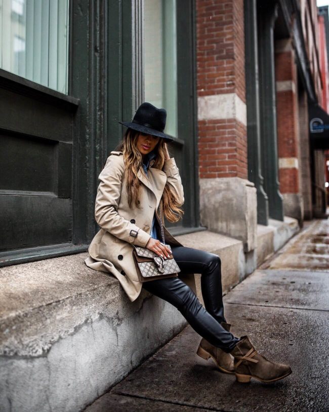 fashion blogger mia mia mine wearing a burberry trench and italeau waterproof booties