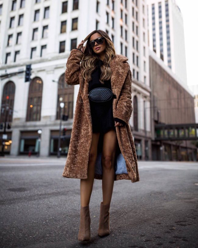 fashion blogger mia mia mine wearing a teddy coat and belt bag from lord & taylor