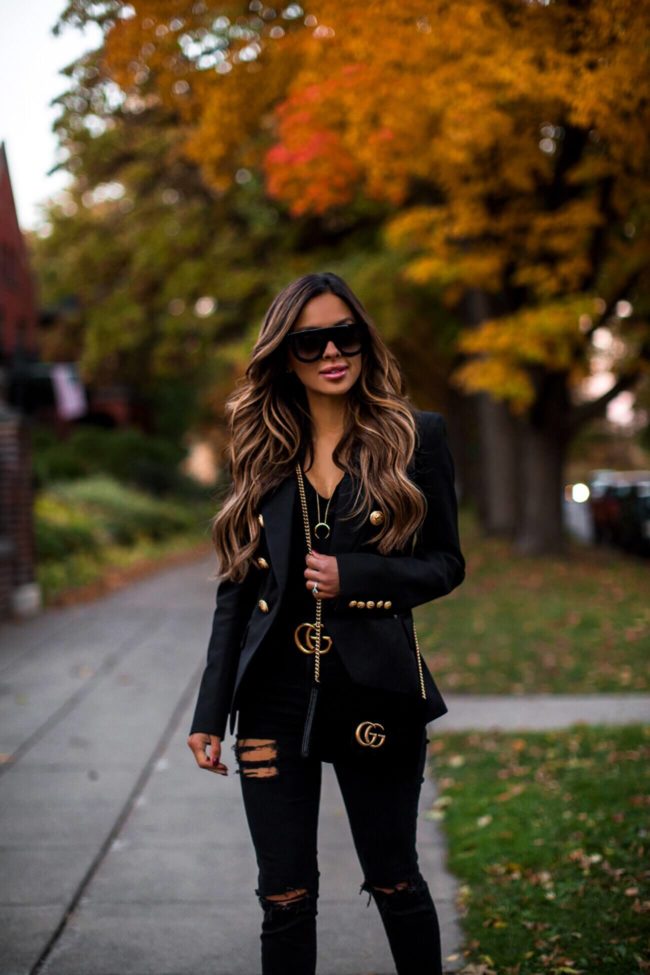 fashion blogger mia mia mine wearing a balmain blazer and a gucci belt