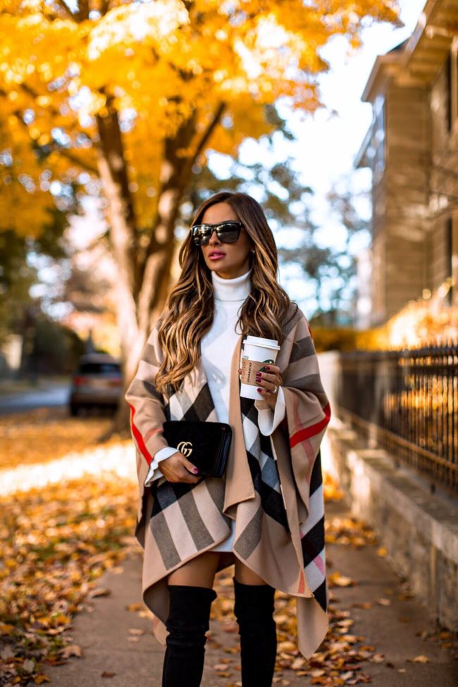 fashion blogger mia mia mine wearing a gucci marmont velvet bag and a burberry poncho