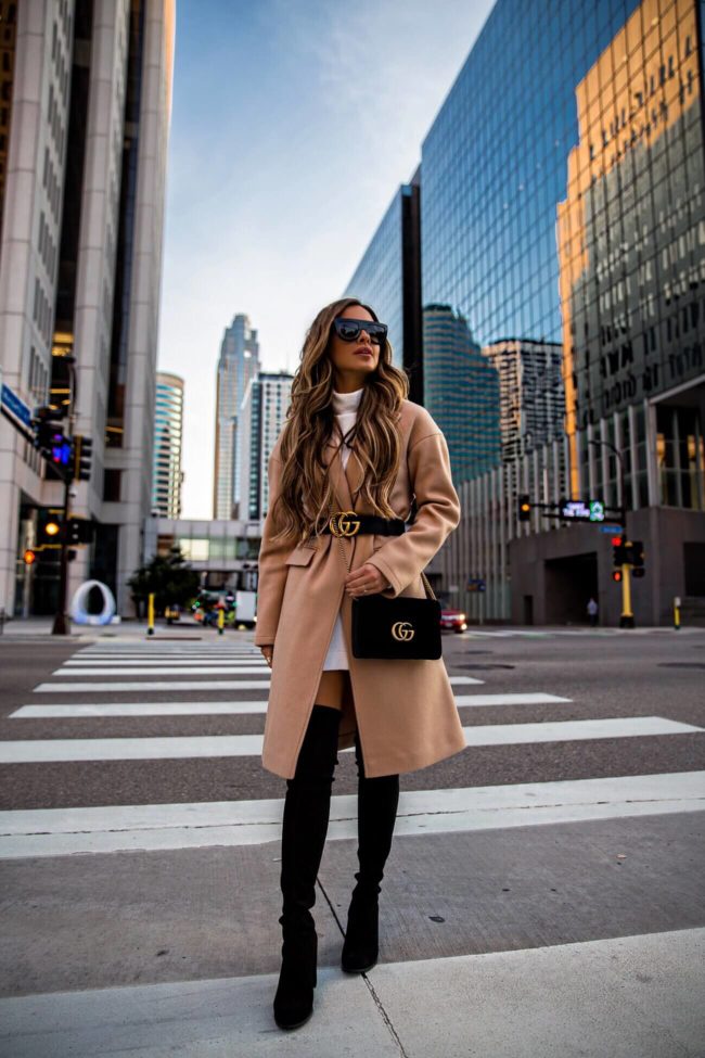 fashion blogger mia mia mine wearing a camel coat and a gucci marmont velvet bag