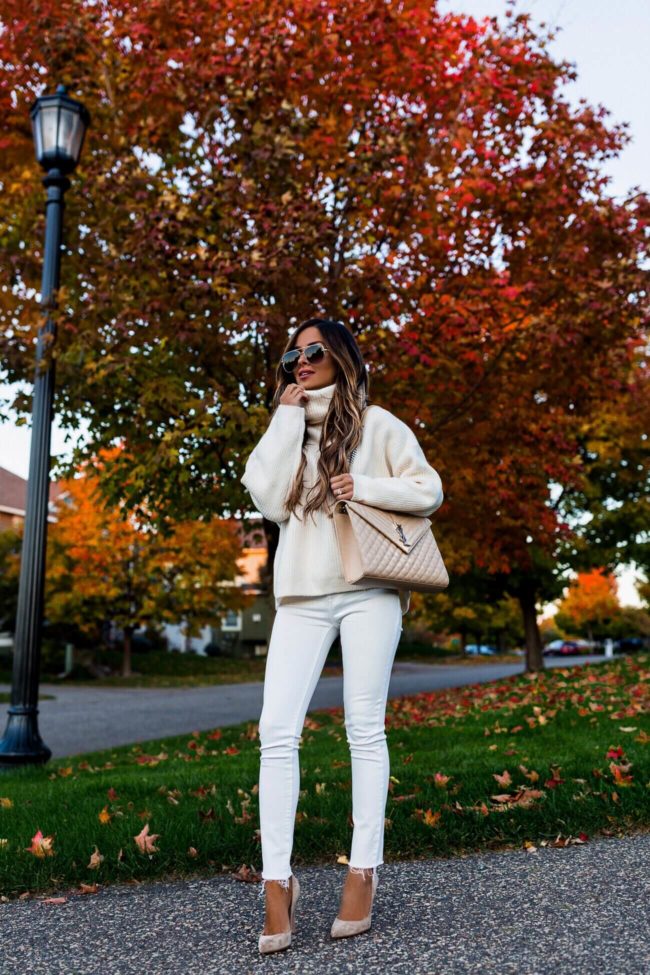 fashion blogger mia mia mine wearing a white turtleneck from H&M and white denim