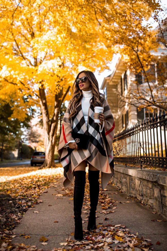 fashion blogger mia mia mine wearing a burberry poncho for fall