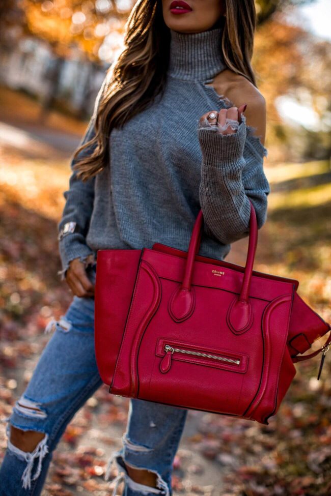 fashion blogger mia mia mine wearing a red celine luggage tote and distressed denim by grlfrnd