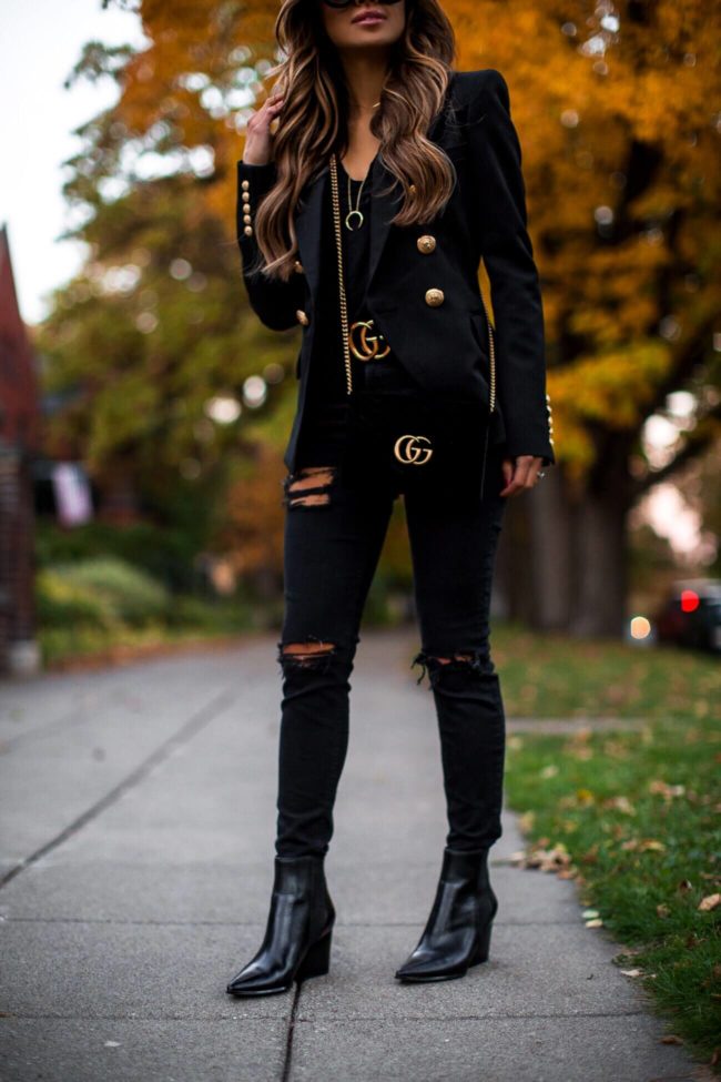 fashion blogger mia mia mine wearing a gucci belt and a balmain blazer
