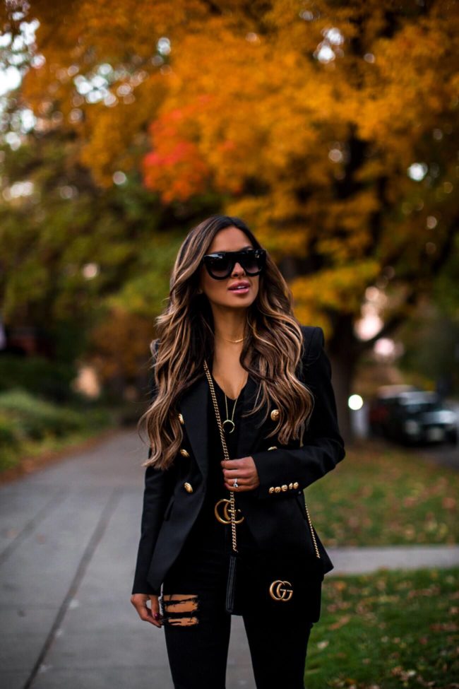 fashion blogger mia mia mine wearing a balmain blazer and gucci marmont bag