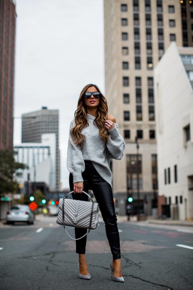 fashion blogger mia mia mine wearing a saint laurent college bag and faux leather pants