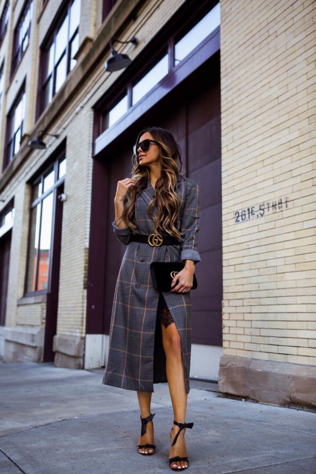 fashion blogger mia mia mine wearing a plaid coat and a gucci belt