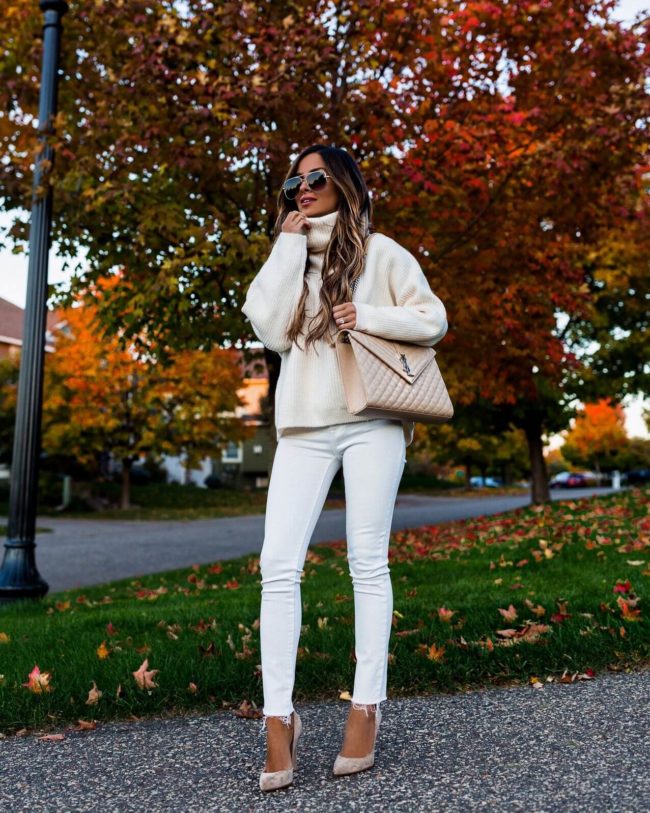fashion blogger mia mia mine wearing a white chunky turtleneck sweater and white jeans from H&M