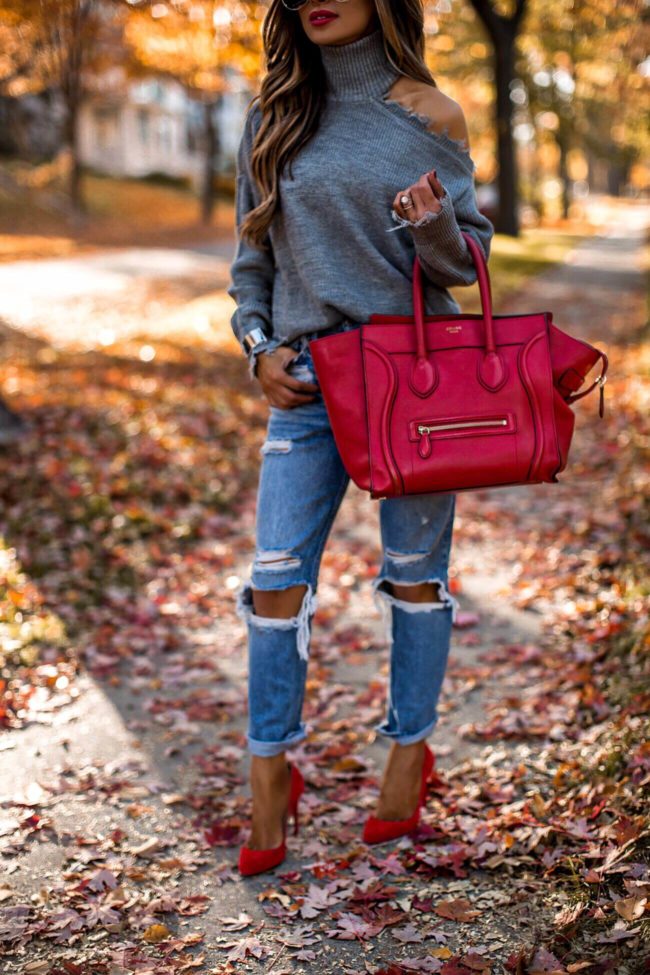 fashion blogger mia mia mine wearing red heels and distressed denim on sale for black friday 2018