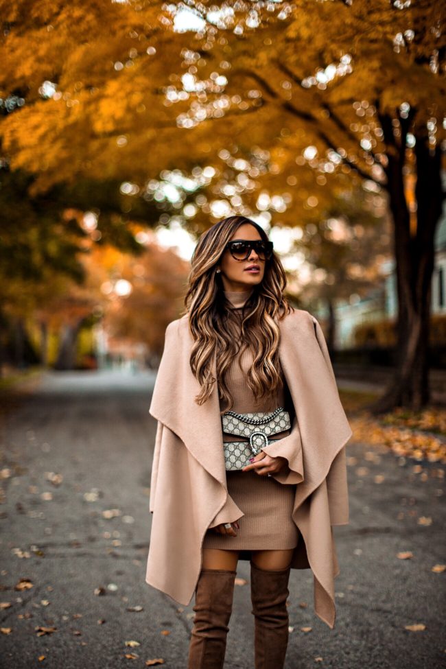 fashion blogger mia mia mine wearing a camel coat and a camel sweater dress from revolve