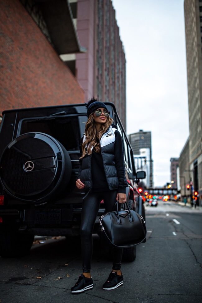 fashion blogger mia mia mine wearing a down nike vest and a givenchy antigona bag on sale for cyber monday