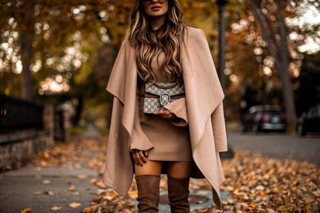 fashion blogger mia mia mine wearing a camel coat and stuart weitzman over-the-knee boots