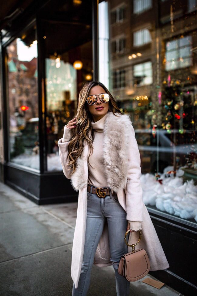 fashion blogger mia mia mine wearing a pink faux fur collar coat from club monaco for winter