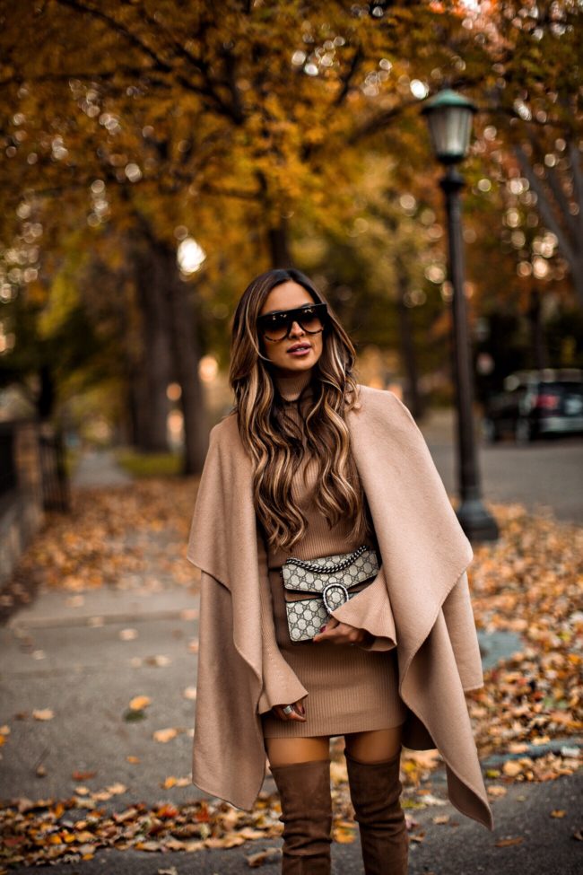 fashion blogger mia mia mine wearing a camel coat and a gucci bag