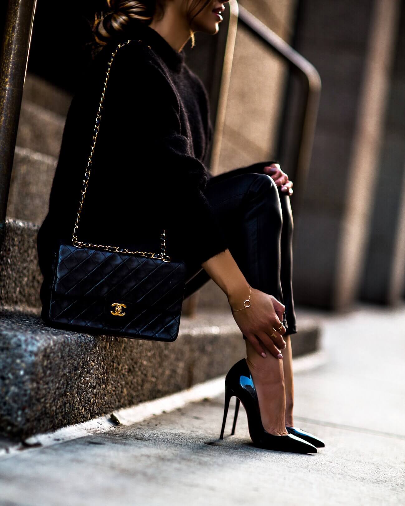 fashion blogger mia mia mine wearing a chanel double flap bag and christian louboutin heels