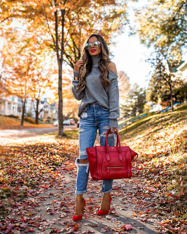 fashion blogger mia mia mine wearing a gray turtleneck sweater and grlfrnd ripped jeans from revolve